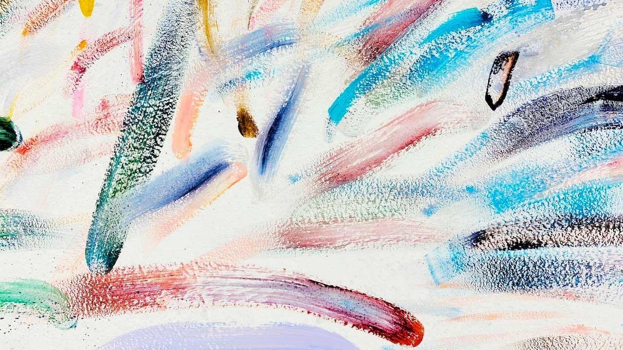 wipes of paint brush strokes mixed colors red teal yellow black