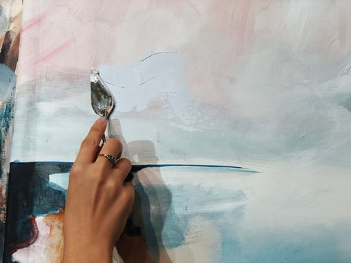 Palette knife on pink and blue canvas