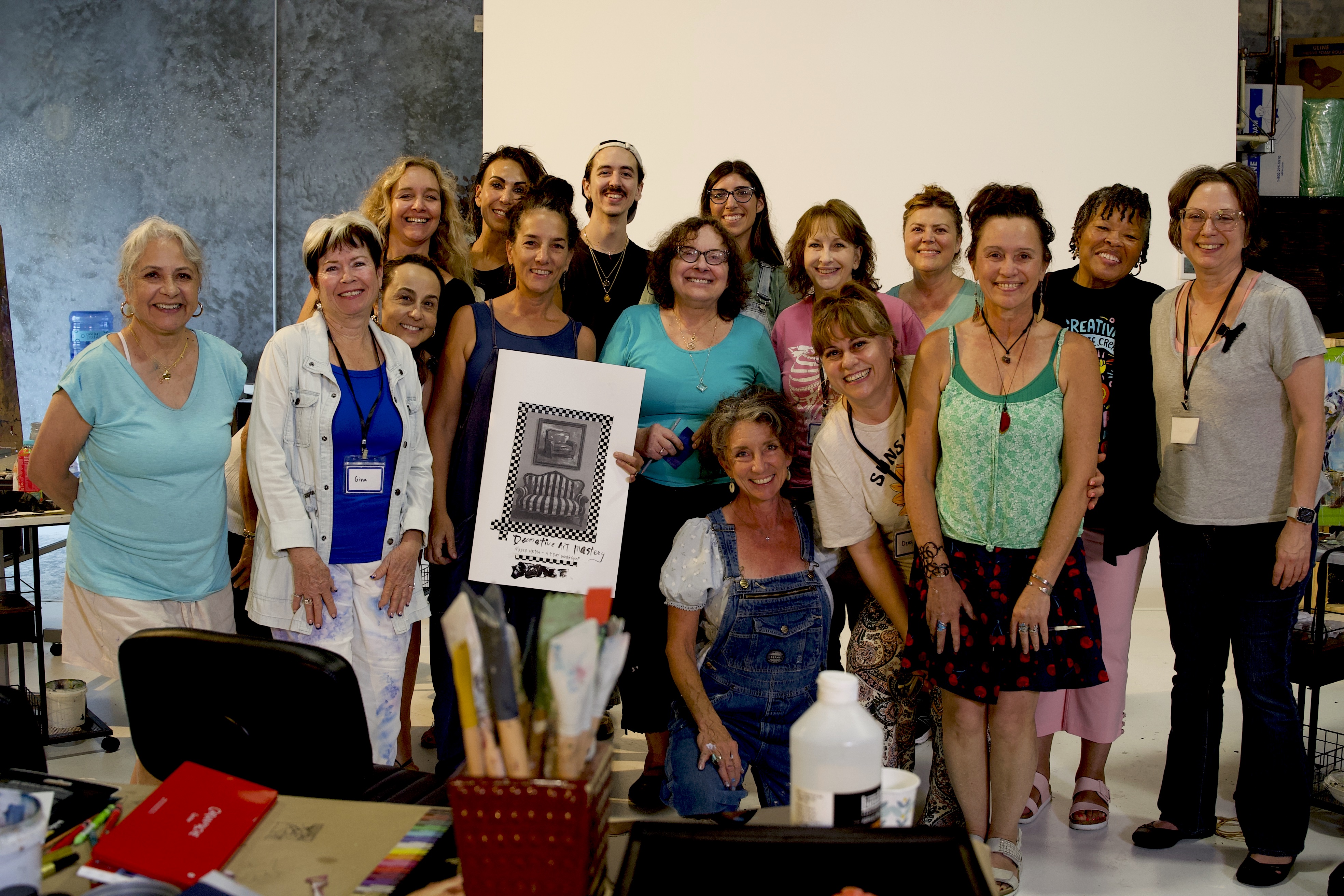 Group of artist standing together in gallery