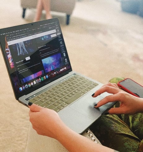 person sitting at laptop
