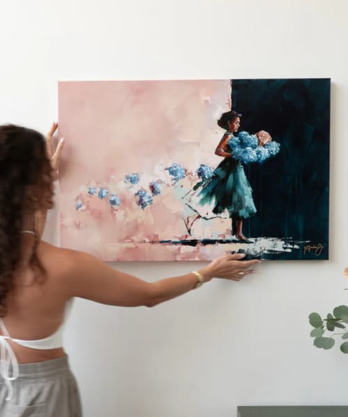 andrea artists with painting of woman blue and pink flowers