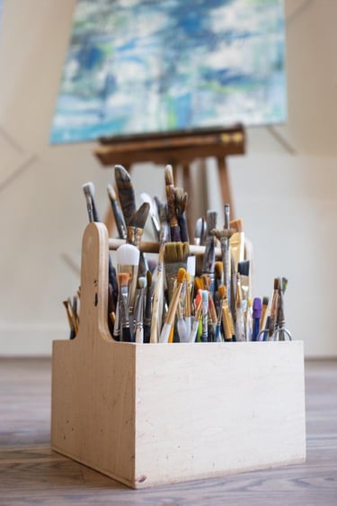 container holding paintbrushes