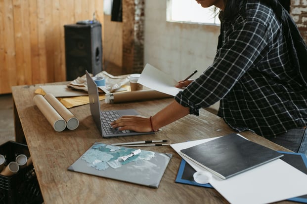 Woman artist using computer and sending out art prints surface-Pfmow4b9GAY-unsplash-1