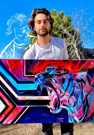 man holding painting of tiger in blue red pink paint