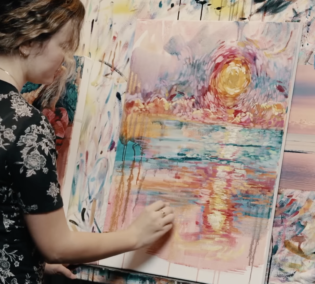 Women painting on paper Monet style painting  yellow green pink