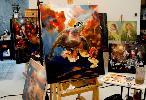 Painting of turtle on easel in gallery